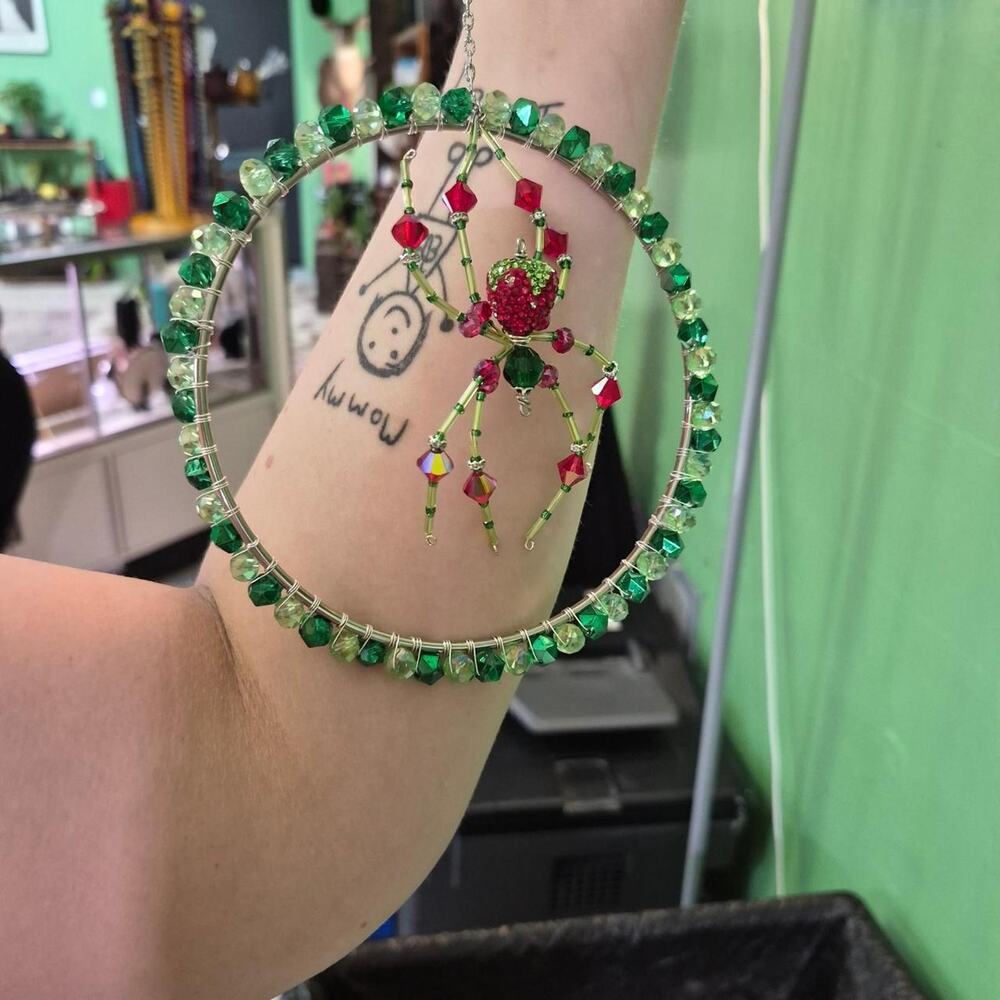 Green and red beaded spider